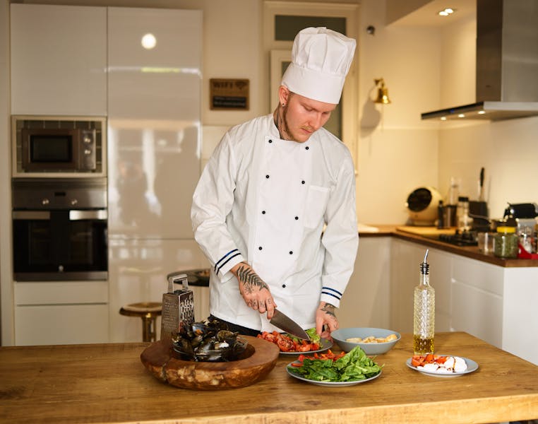 Chef preparing fresh catering dishes